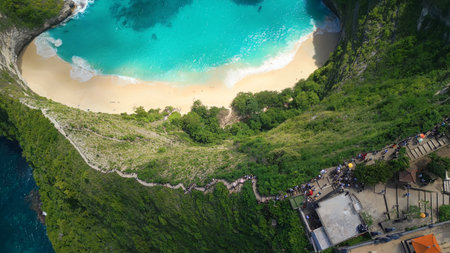 Kelingking Beach Aerial with Crowded Stair Trail to Turquoise Coveの写真素材