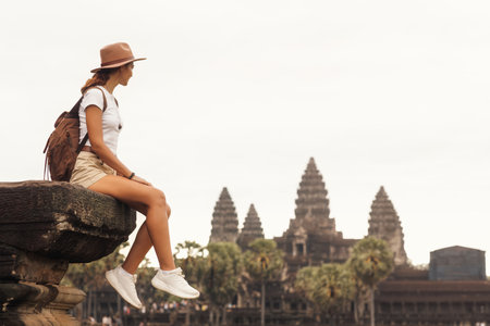 Backpacker Woman Looking Over Angkor Wat, Iconic Cambodia Temple View