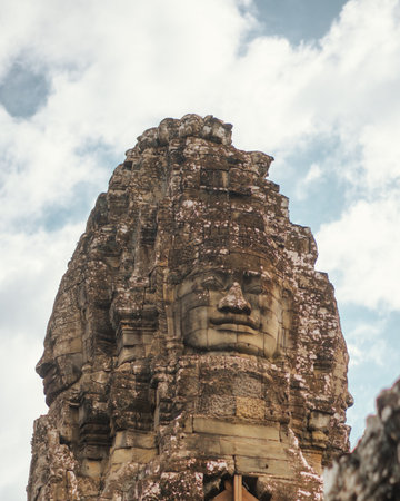 Iconic Stone Face Of Bayon Temple In Angkor Wat, Cambodiaの写真素材