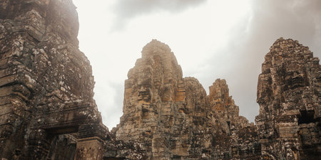 Mysterious Spires Of Ancient Bayon Temple In Angkor Wat, Cambodiaの写真素材