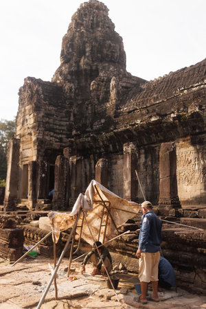 Cultural Conservation Team Restoring Bayon Temple In Cambodiaの写真素材