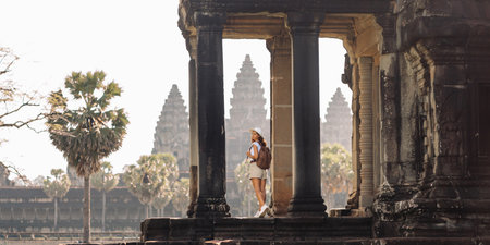 Angkor Wat Columns With Female Backpacker, Iconic Khmer Temple Viewの写真素材