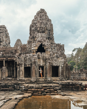 Female Traveler At Bayon Temple Doorway, Angkor Thom, Cambodia Tourismの写真素材