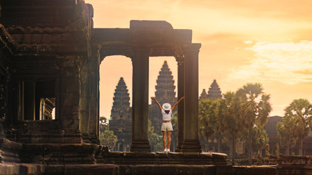 Celebrating Sunrise At Angkor Wat Columns, Female Backpacker, Cambodiaの写真素材