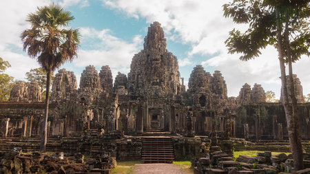Ancient Cambodian Temple Bayon At Angkor Wat Under Blue Skyの写真素材