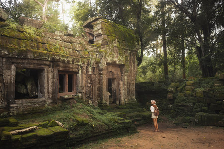 Traveler At Ta Prohm Temple Ruins, Angkor Wat, Cambodia Jungle Dawn Adventureの写真素材