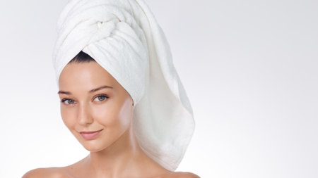 Spa Beauty Concept With Woman In White Towel On Clean Backgroundの写真素材