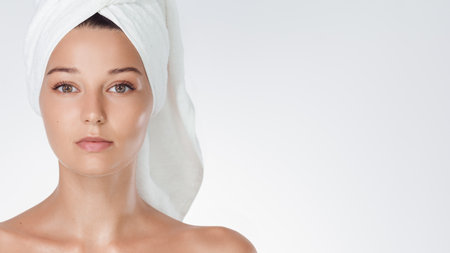 Fresh Faced Woman After Bath On White Background For Skincare Adsの写真素材