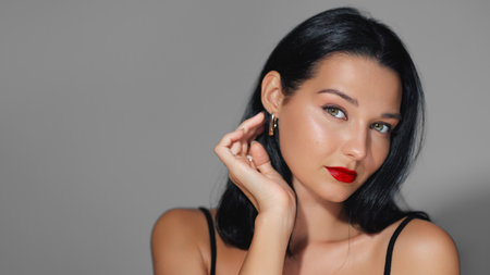 Stunning Latina Woman With Bold Red Lips And Elegant Poseの写真素材