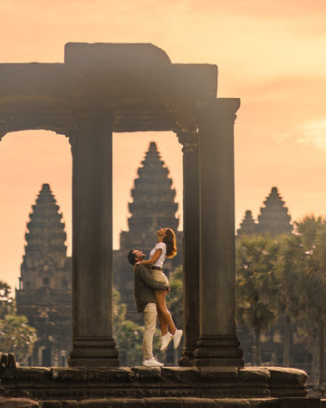 Romantic Couple At Angkor Wat Sunrise Embracing In Ancient Temple
