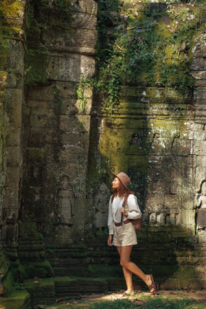 Solo Female Traveler Exploring Ancient Jungle Temple Ruins Cambodia