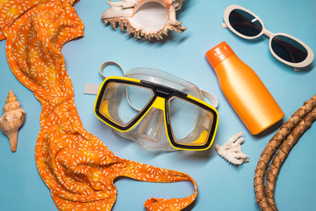 Summer Beach Flat Lay With Snorkel Mask Sunglasses Shells On Blue