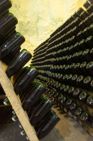 Wine-bottles, old and dusty containing wine