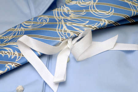 ties of different colors lie on a shirtの写真素材