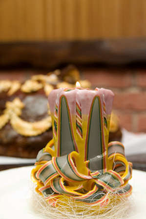 Candle in the form of ribbons in the foreground