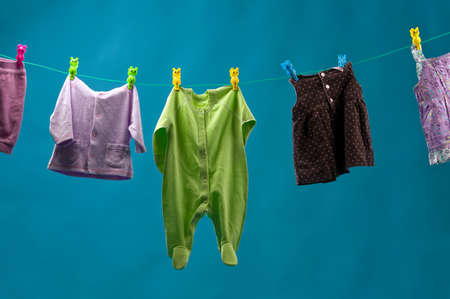 clothing for children dry on a rope.の写真素材