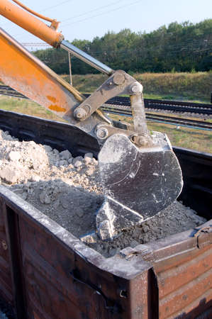 Loader loads the wagon train transportの写真素材