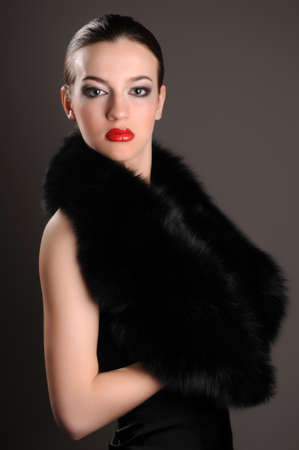 beautiful brunette in an elegant dress in the studioの写真素材