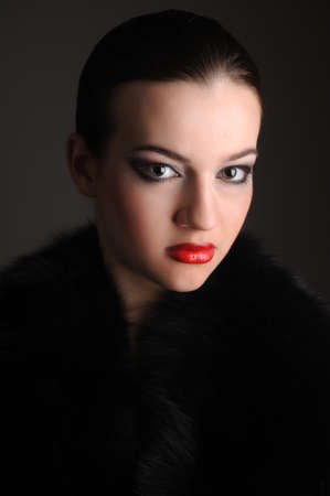 beautiful brunette in an elegant dress in the studioの写真素材