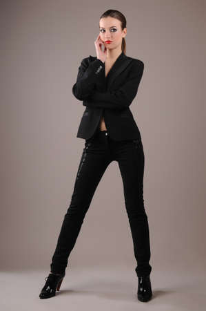 cute brunette in a denim suit with a isolated backgroundの写真素材