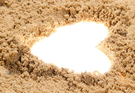 Heart symbol drawn on the white beach sandの写真素材