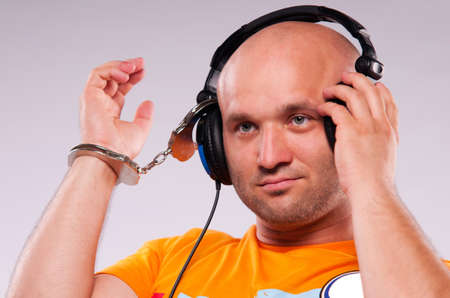 man with earphones on gray backgroundの写真素材