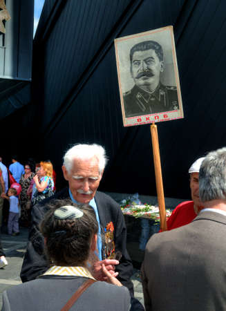 DONETSK, UKRAINE - MAY 9 Unidentified veterans at Victory Monument during the celebration of Victory...