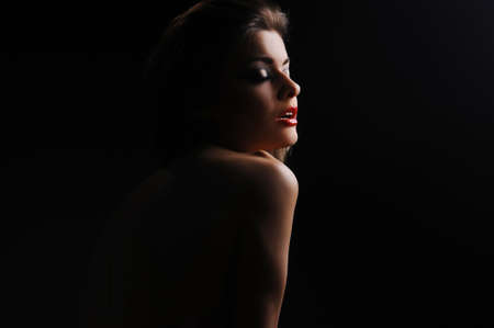 portrait of a woman on a black backgroundの写真素材