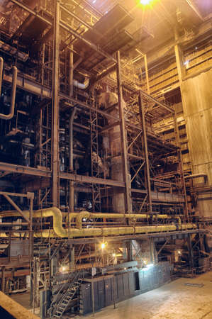 Pipes, tubes, machinery and steam turbine at a power plantのeditorial素材