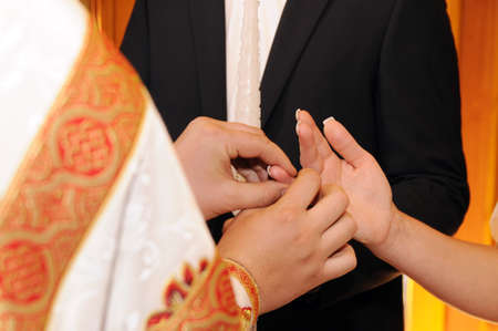 The groom and the bride. Wedding ceremony in churchの写真素材