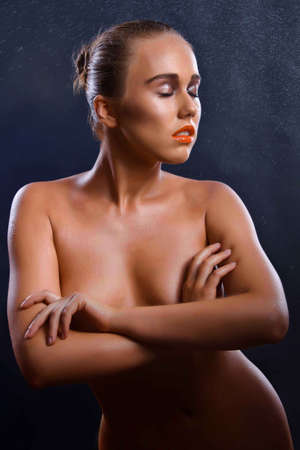 pretty young woman, a black backgroundのeditorial素材