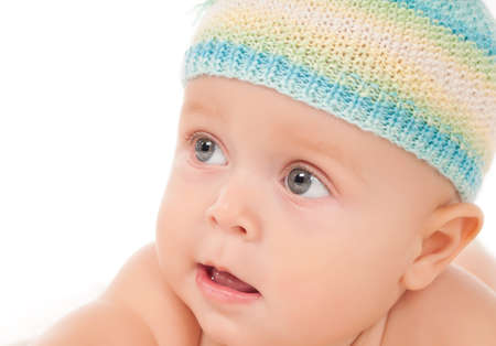 Portrait of a baby in a towel on a white background