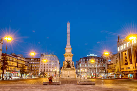 Square at night in the center of the city. Romantic Lisbon street with the typical old buildings and new buildingsの写真素材