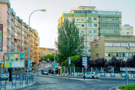 Romantic Lisbon street with the typical old buildings and new buildingsのeditorial素材
