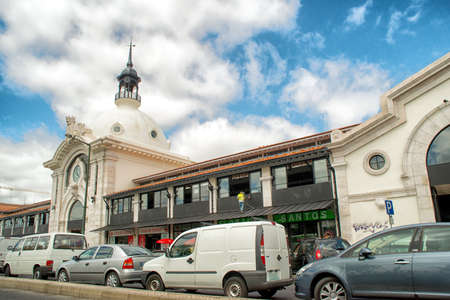 Romantic Lisbon street with the typical old buildings and new buildingsのeditorial素材