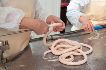 Meat plant traditional sausage during the preparationの写真素材