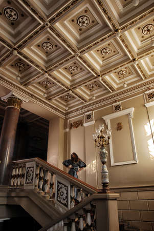 Beautiful women in the clothing of the 18th century in a luxurious interiorの写真素材