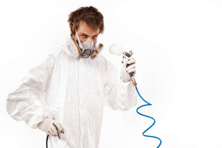 Worker with airbrush gun, isolated on white backgroundの写真素材