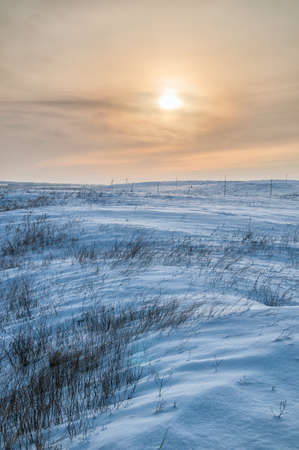 A winter landscape showing a foggy river on a cold dayの写真素材