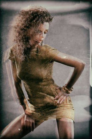 Pretty girl in a green dress with a gray background. The stylized photo of the girl, postprocessing.の写真素材