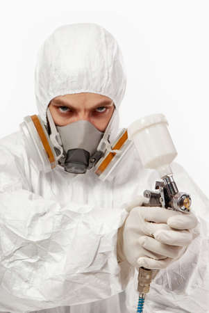 Worker with airbrush gun, isolated on white backgroundの写真素材