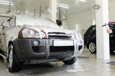 car covered in foam at the carwash