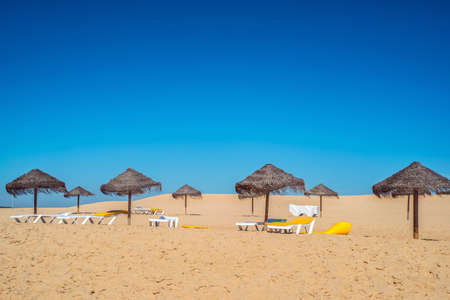 Umbrella at the shore of the Atlantic Ocean, Portugalの写真素材