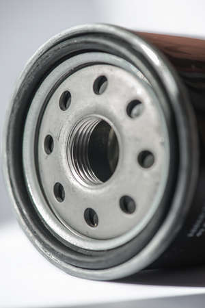 Oil filter cleaning internal combustion engine on a white background