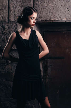 fashion woman portrait where she is leaning against a brick wall
