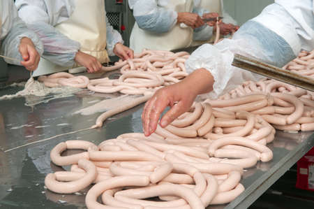 Meat plant traditional sausage during the preparationの写真素材