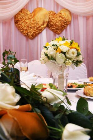 Beautiful wedding restaurant for marriage. White decor for bride and groom. Colorful decoration for celebration. Beauty bridal interior. Bouquet and flowers in hallの写真素材