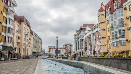 Tall in the sky above Stavropol, statue of an angel with a cross. And the central pedestrian street. Russia.のeditorial素材