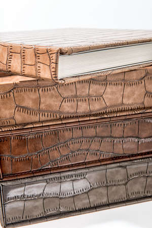 different sizes albums and books on a white backgroundの写真素材