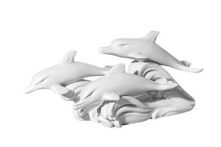 Classical marble statue of dolphins on a white backgroundの写真素材